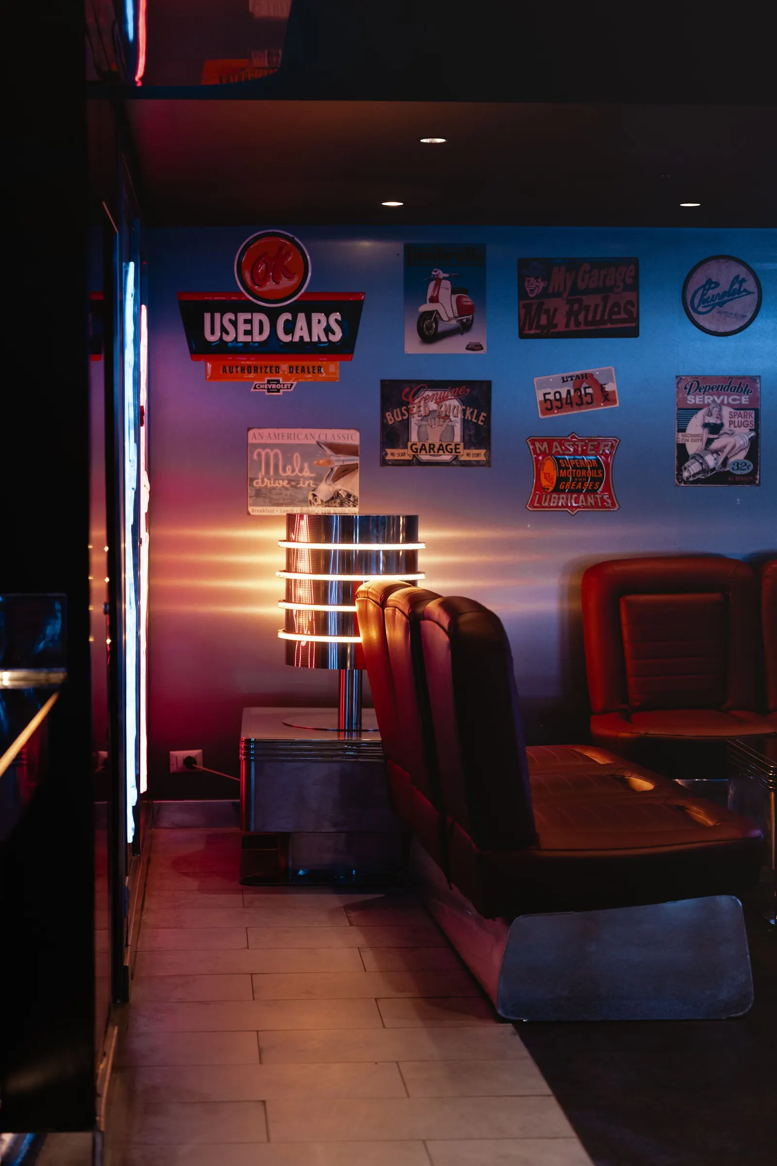 The dining room, warm light and leather booths